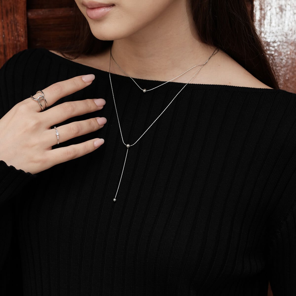 woman-models-a-chic-double-layer-necklace.jpg